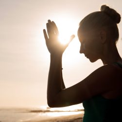 beautiful woman meditating outdoors. bali