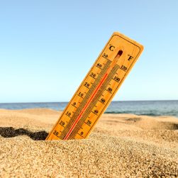 closeup-shot-thermometer-beach-sand