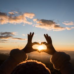 silhouette-hands-forming-heart-shape-with-sunrise