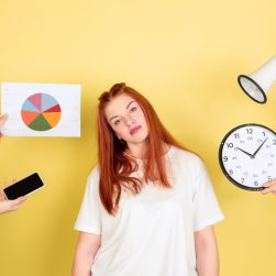 tired-caucasian-young-woman-s-portrait-yellow-studio-background-too-much-tasks-how-manage-time-right-concept-office-working-business-finance-freelance-self-management-planning